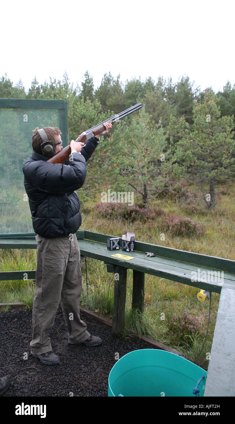 Man clay pigeon shooting, Rothiemurchus Estate, Scotland Stock Photo