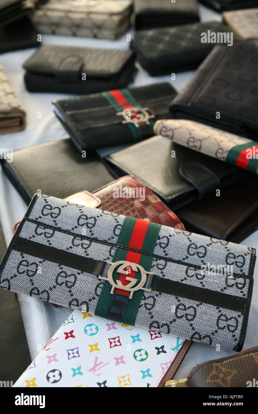 Counterfeit designer purses on sale in Alghero, Sardinia, Italy Stock Photo