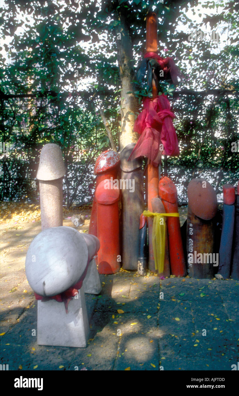 Wooden and stone phalluses at the fertility shrine Sanjao Mae Tuptim in Bangkok city centre Thailand Stock Photo