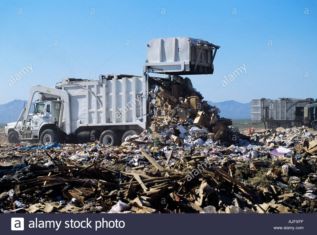 Garbage truck at landfill depositing trash Tucson Arizona USA Stock