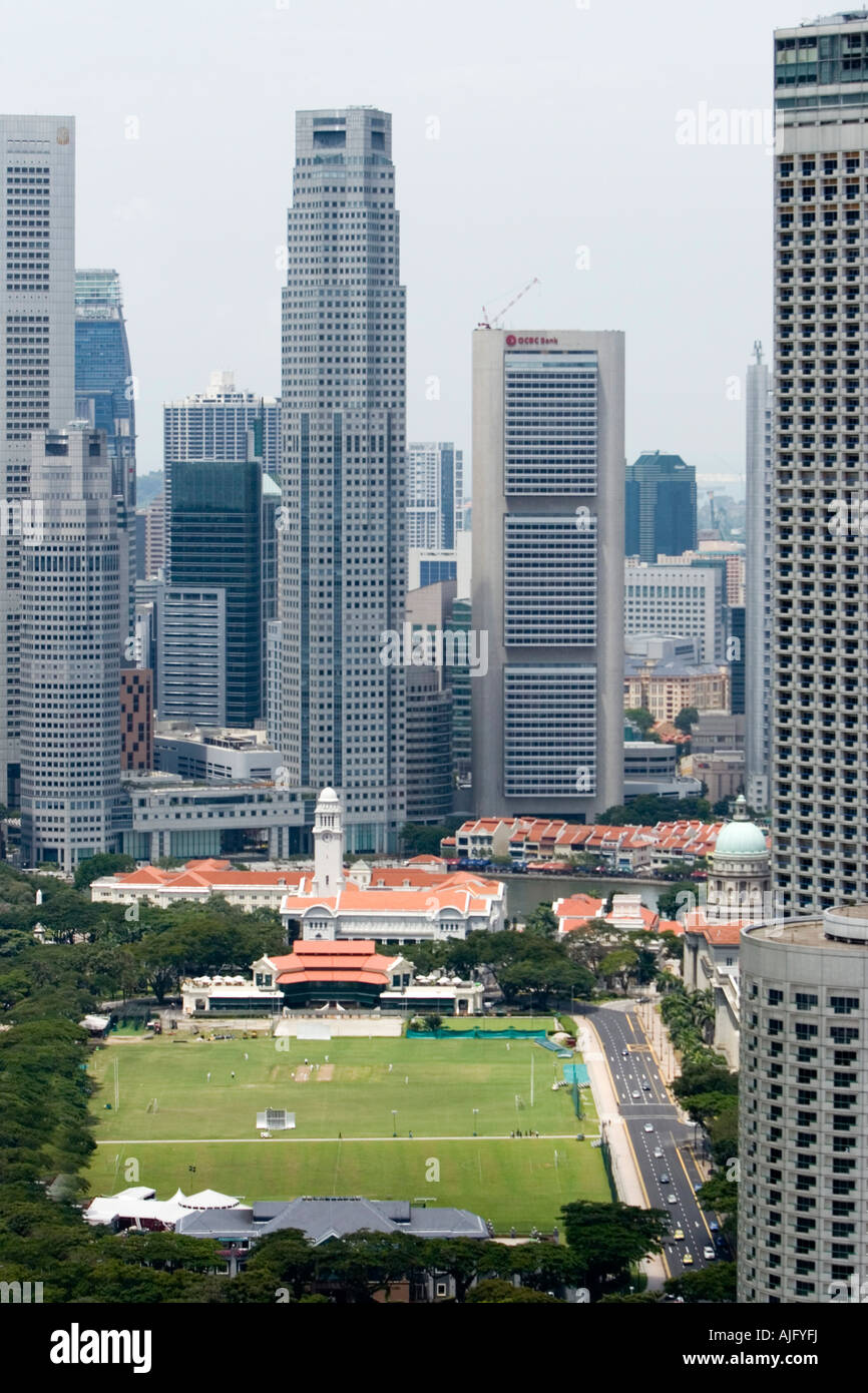 Financial district tower blocks beyond the Padang and Singapore Cricket Club Stock Photo
