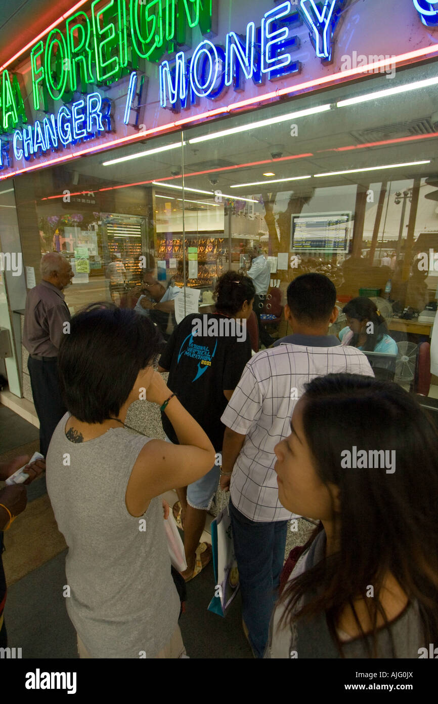 People in Line at a Money Changer Currency Exchange Little India
