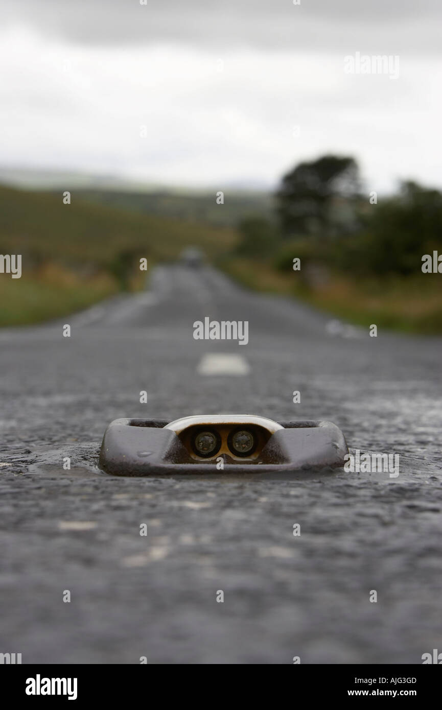 cats eye in the middle of a mountain road in the mourne mountains county down northern ireland Stock Photo