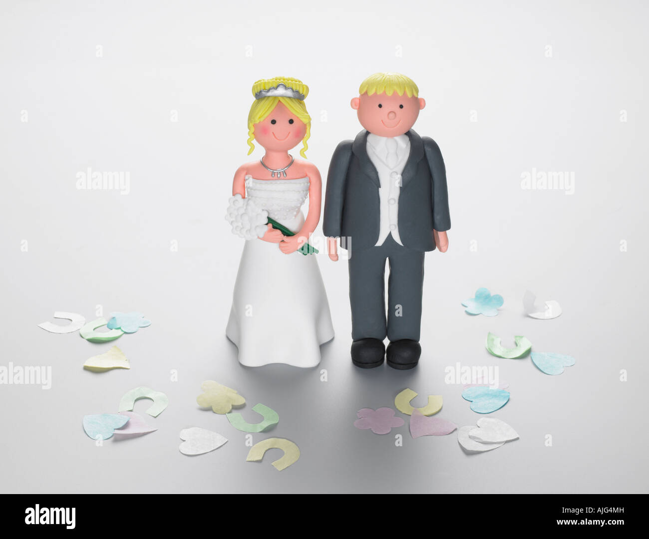 Bride & groom wedding figures with confetti Stock Photo
