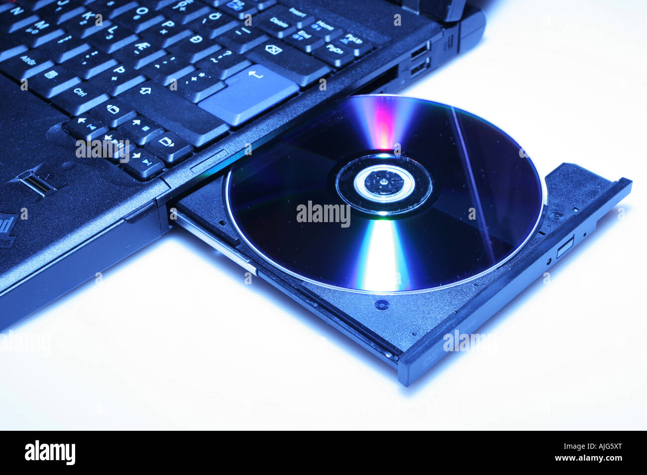 Brand New Laptop With Cd In Open Cd Drive Shot On White Stock Photo Alamy
