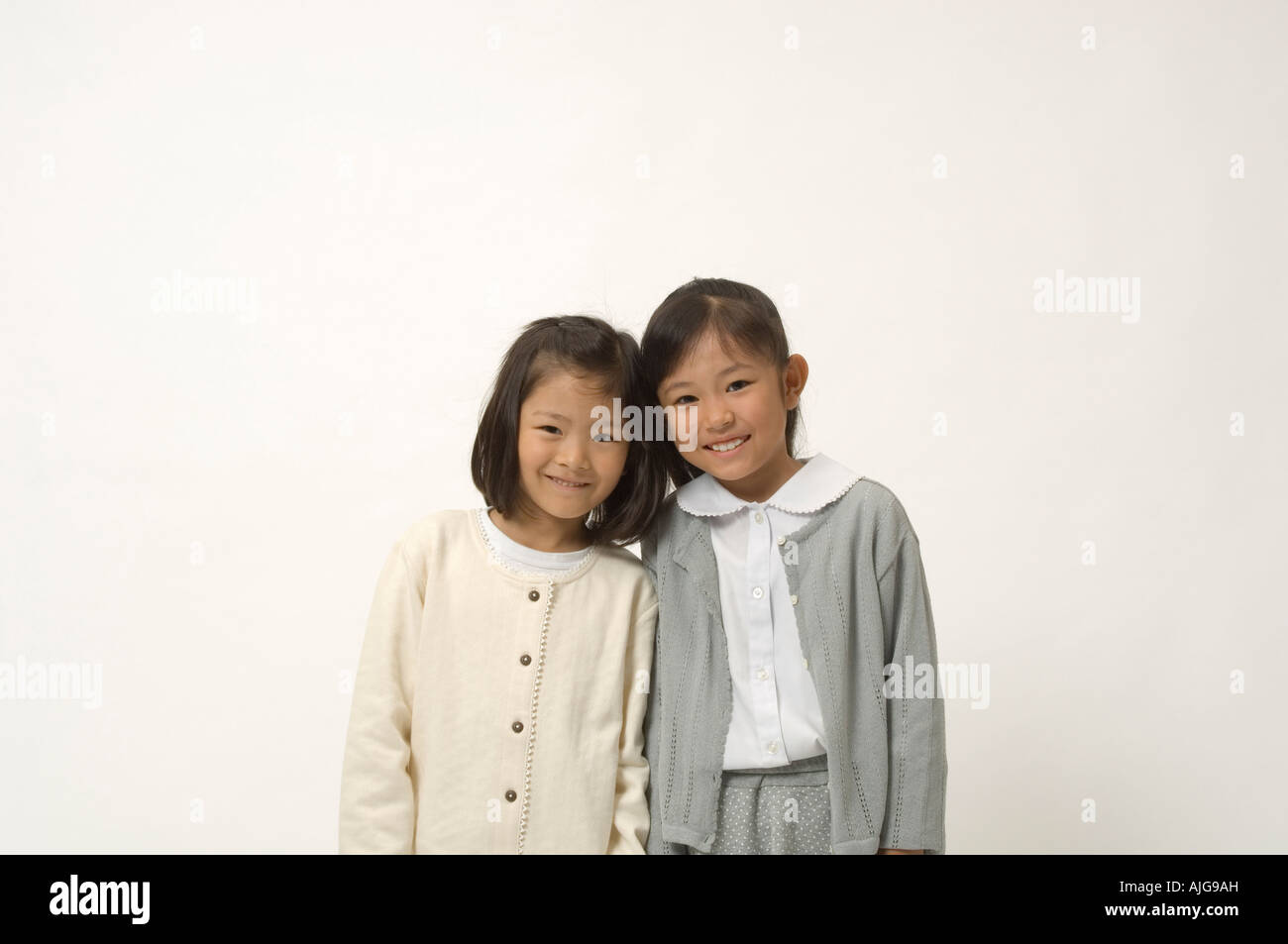 Two elementary age girls smiling Stock Photo