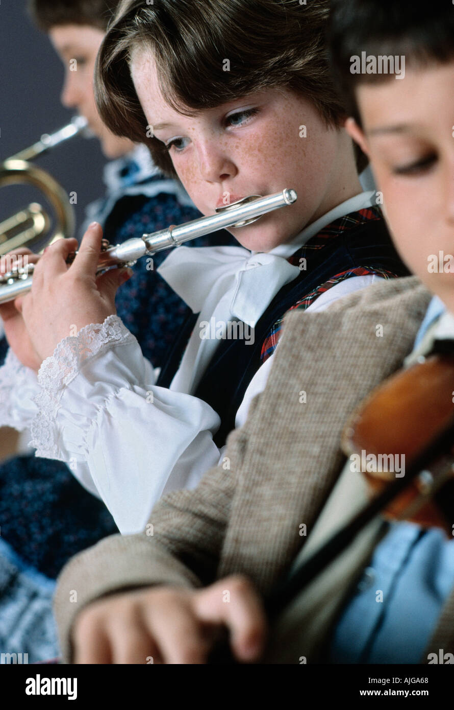 Students playing instruments in elementary school music class Stock