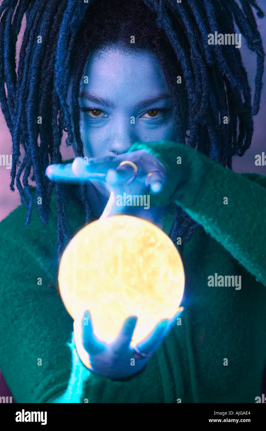 Fortune teller seeing the future using crystal ball Stock Photo