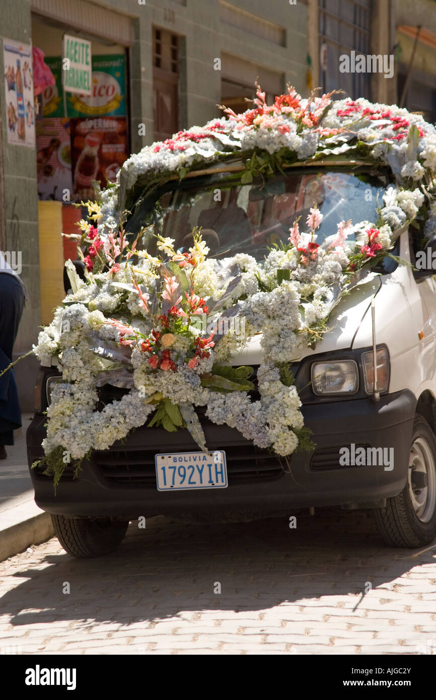 Wedding car covered in flowers in the market district of La Paz