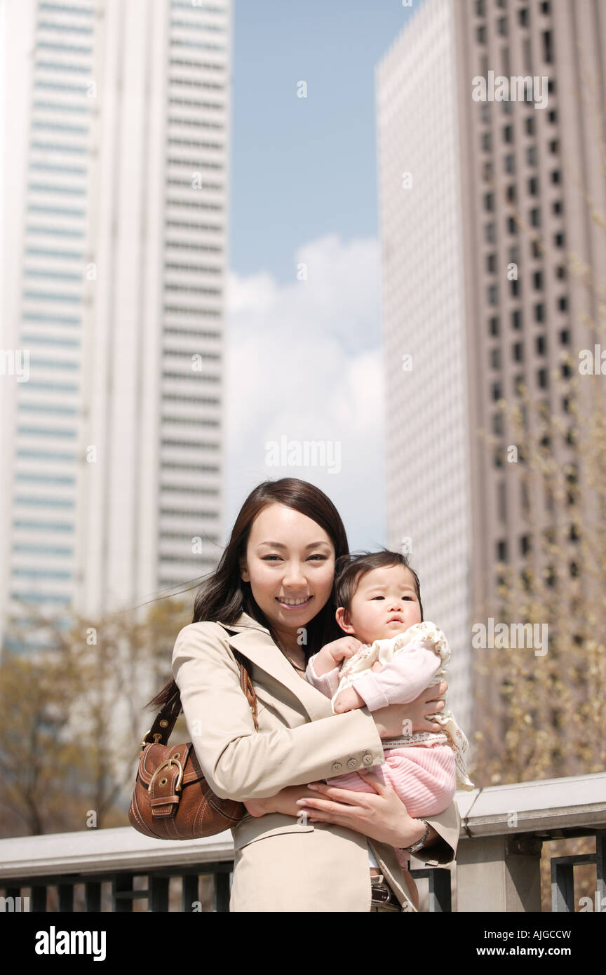 15 years mother holding baby hi-res stock photography and images - Alamy