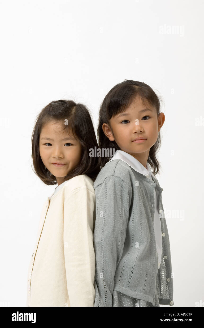 Two elementary age girls looking at camera Stock Photo