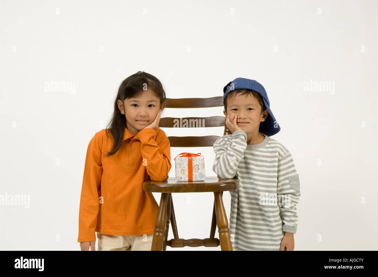 Two elementary age children standing Stock Photo - Alamy