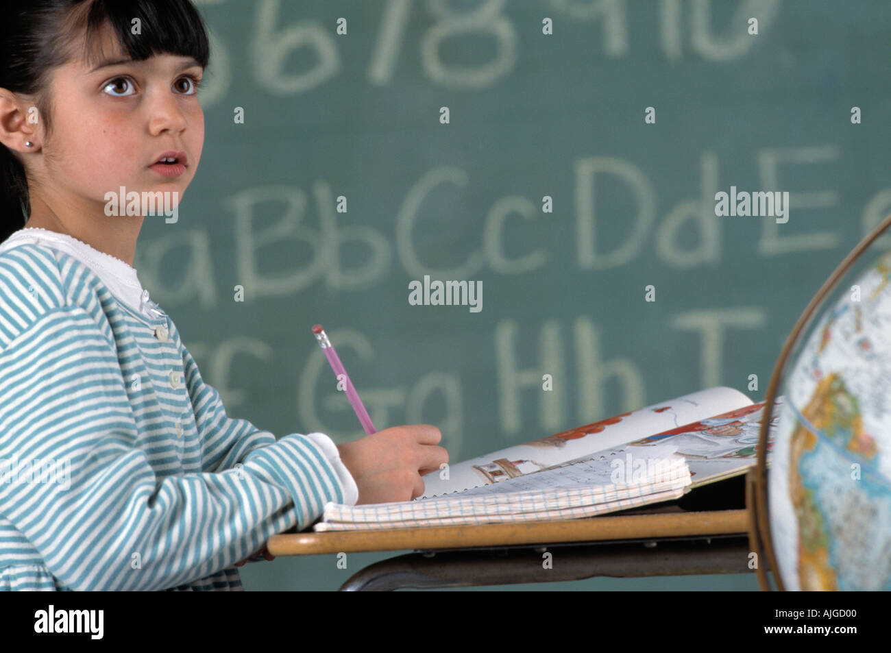 Portrait of Caucasian female student sitting at desk in class Stock ...