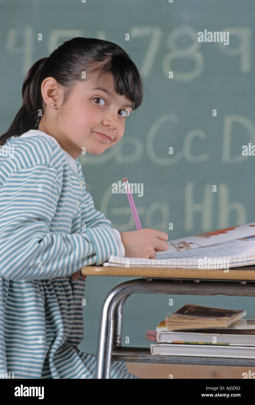 Portrait of Caucasian female student sitting at desk in class Stock ...