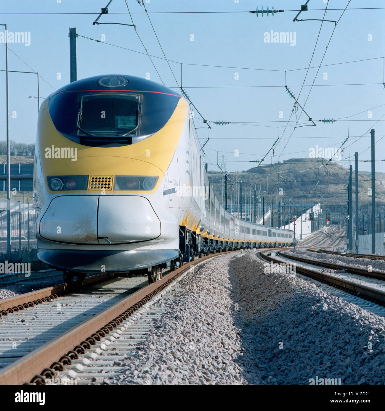 The 300km/h (186mph) Eurostar high-speed train on the Continental Main Line at the Eurotunnel UK Terminal at Folkestone. Stock Photo