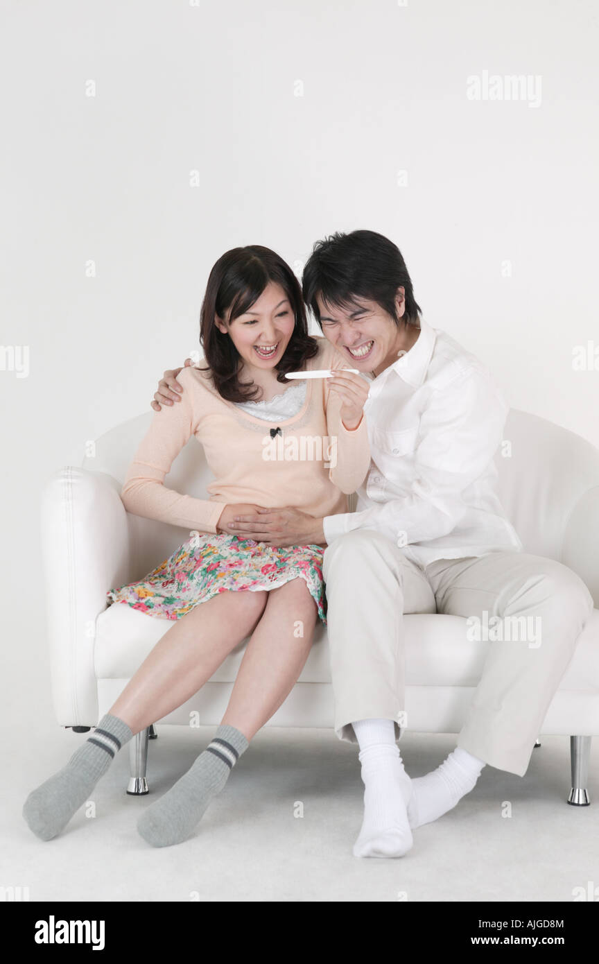 Couple looking at pregnancy test Stock Photo