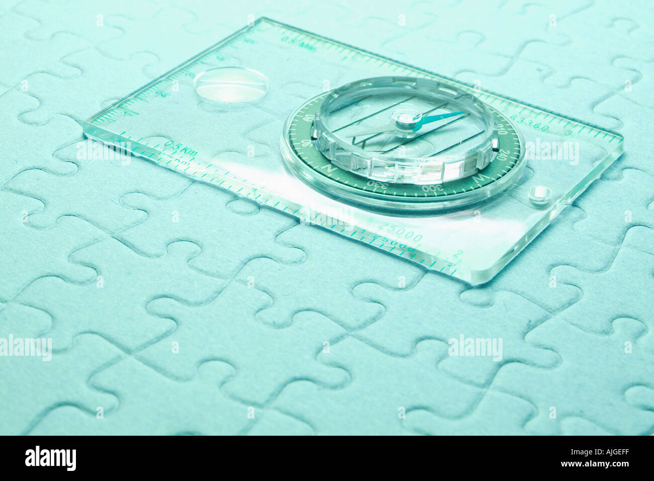 Compass on  Jigsaw Puzzle Stock Photo
