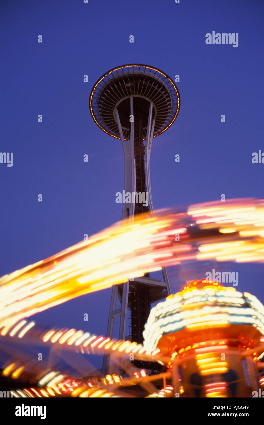 Carnival Ride Lights Make Blurred Ring Around Base Of Seattle Space