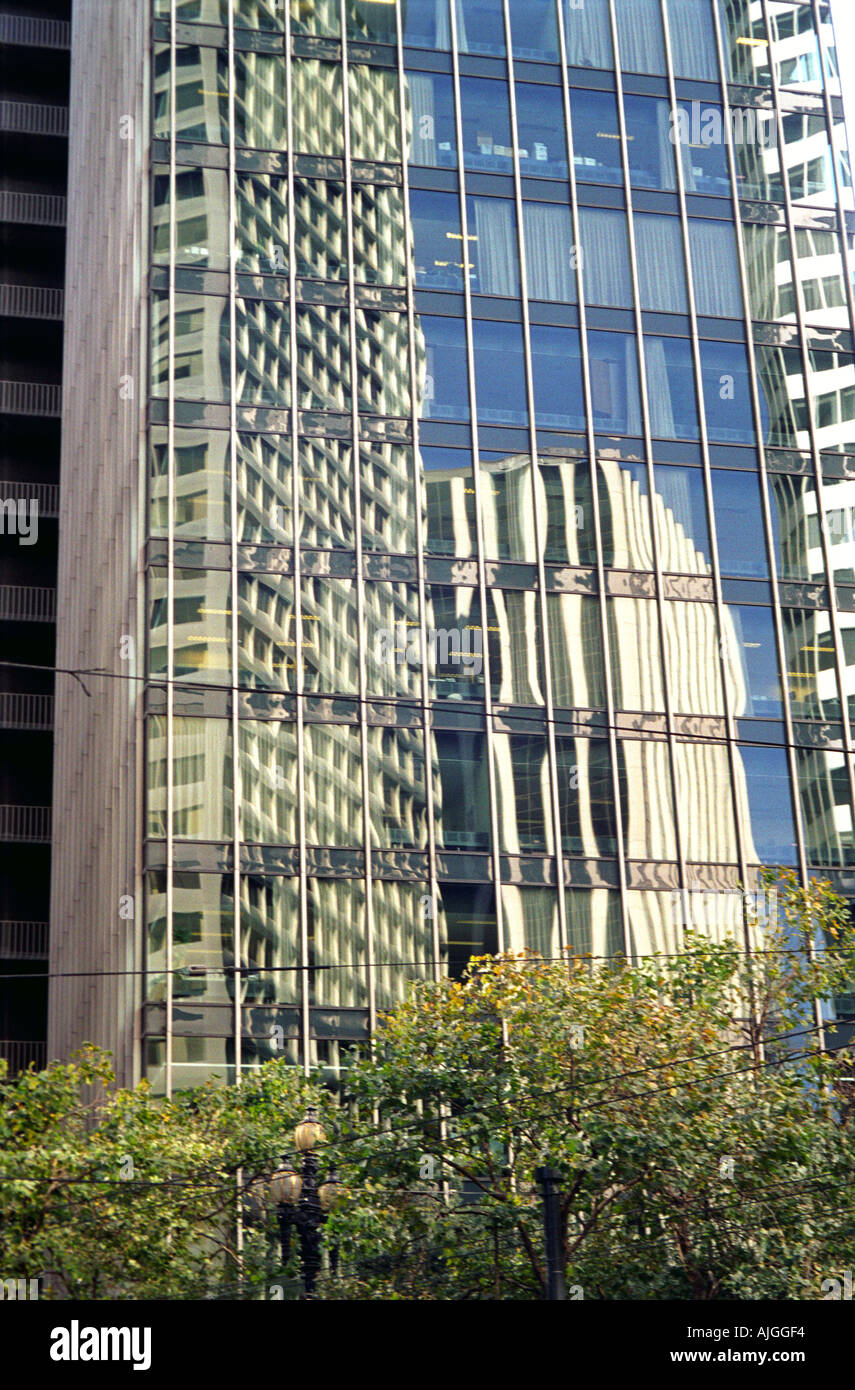 Buildings reflected in an office block in San Francisco Stock Photo