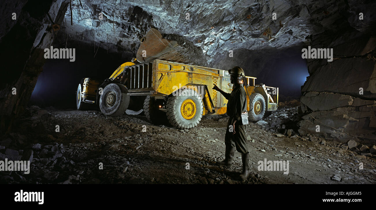 Transporting ore, underground gold mine Ghana West Africa Stock Photo