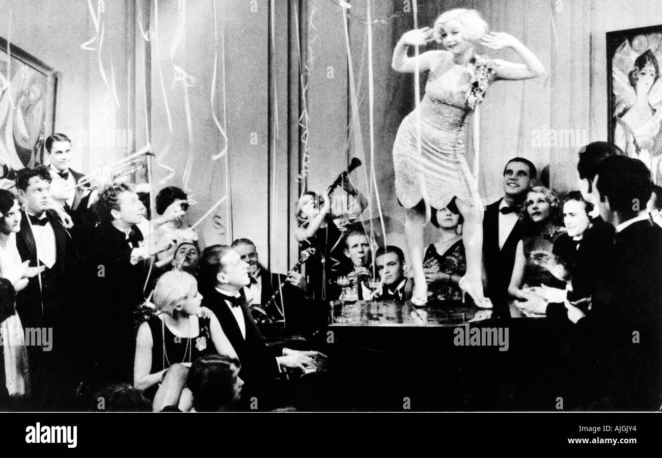 Dancing On The Piano, 1920s movie still of a riotous party in Prohibition America, flapper to the fore in the jazz age Stock Photo