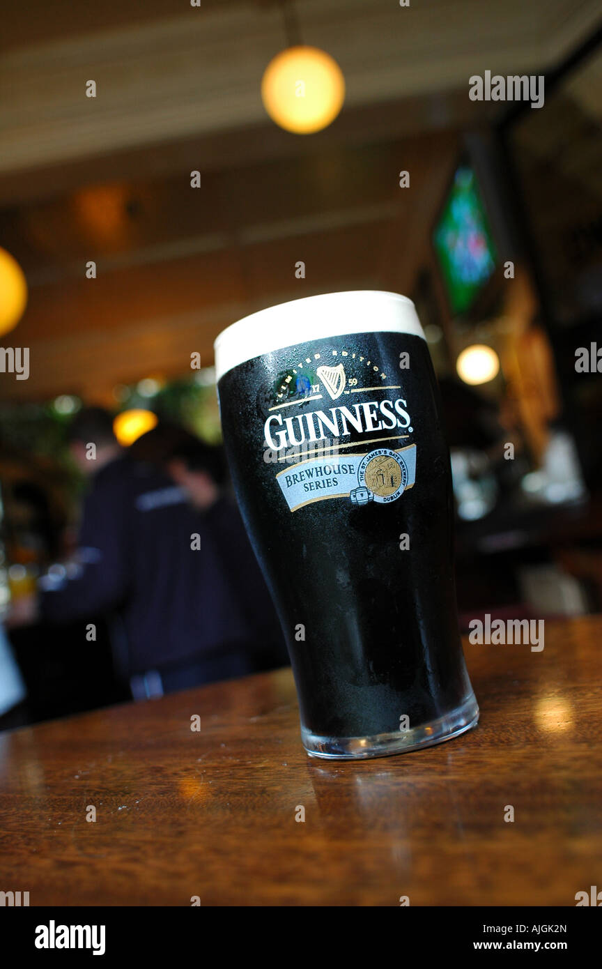 A pint of hand pulled Guinness stood on the table in a traditional