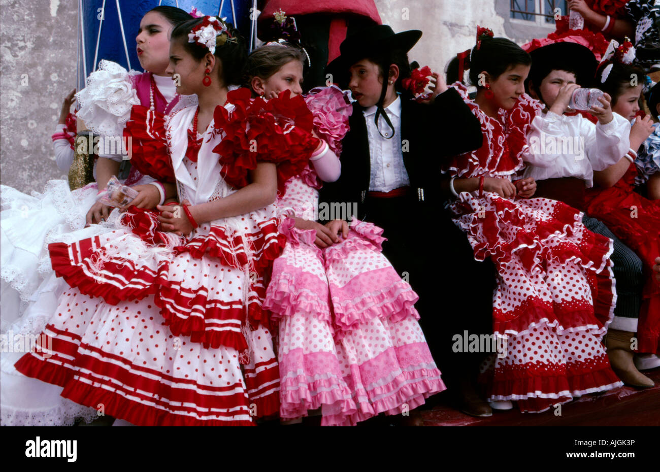 Children in Flamenco costume on a float at the start of an Easter carnival  procession in the Town of Vejer de la Fronterra Stock Photo - Alamy