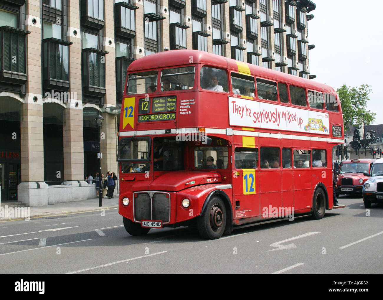 London Routemaster Bus RML 2454 on Route 12 passing Big Ben