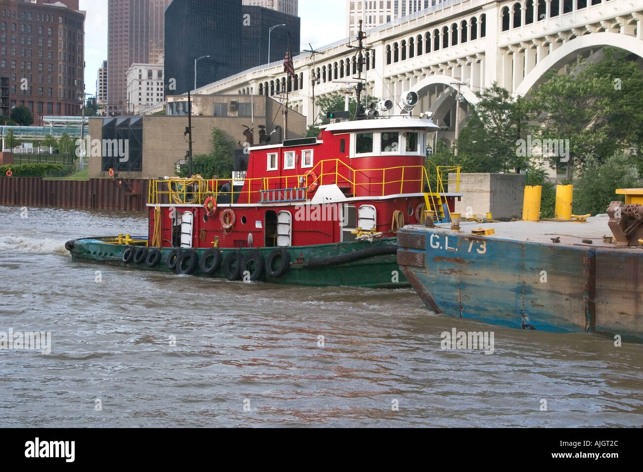 Tugboat pushing barge down Cuyahoga River Stock Photo Alamy