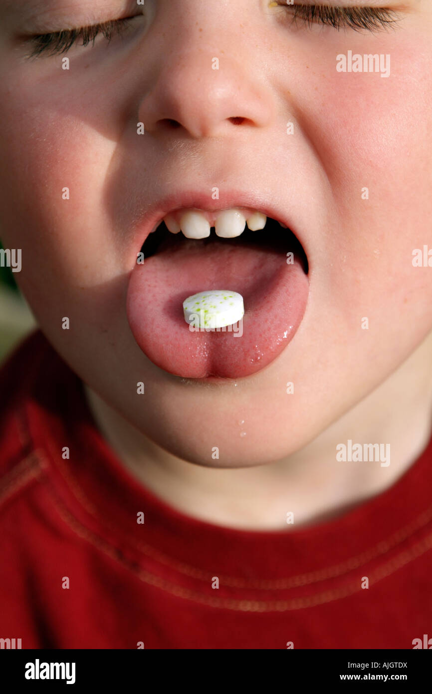 Tablet on Tongue of Little Boy Child Taking a Pill with his mouth wide open Stock Photo Alamy