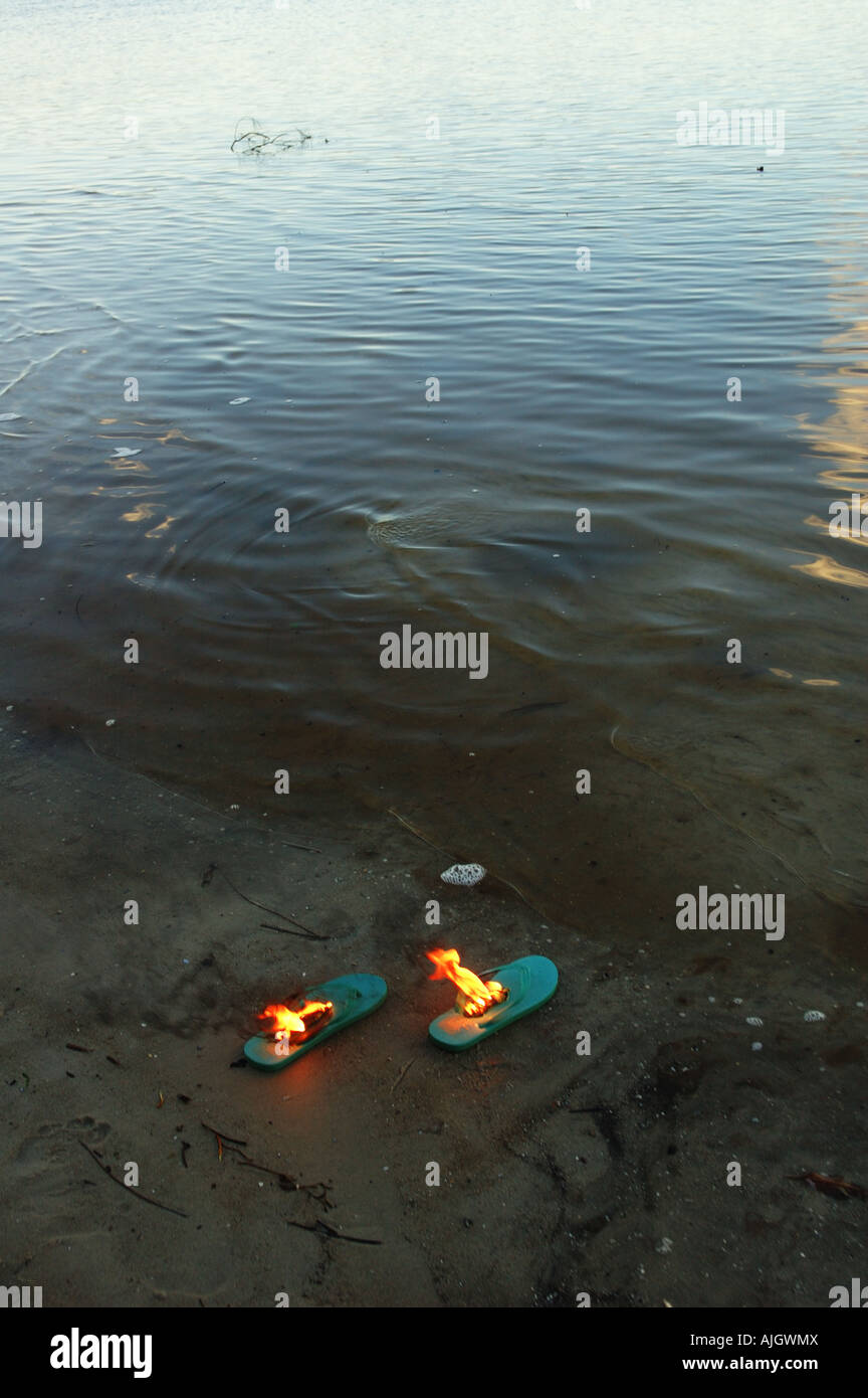 burning flip flops Stock Photo