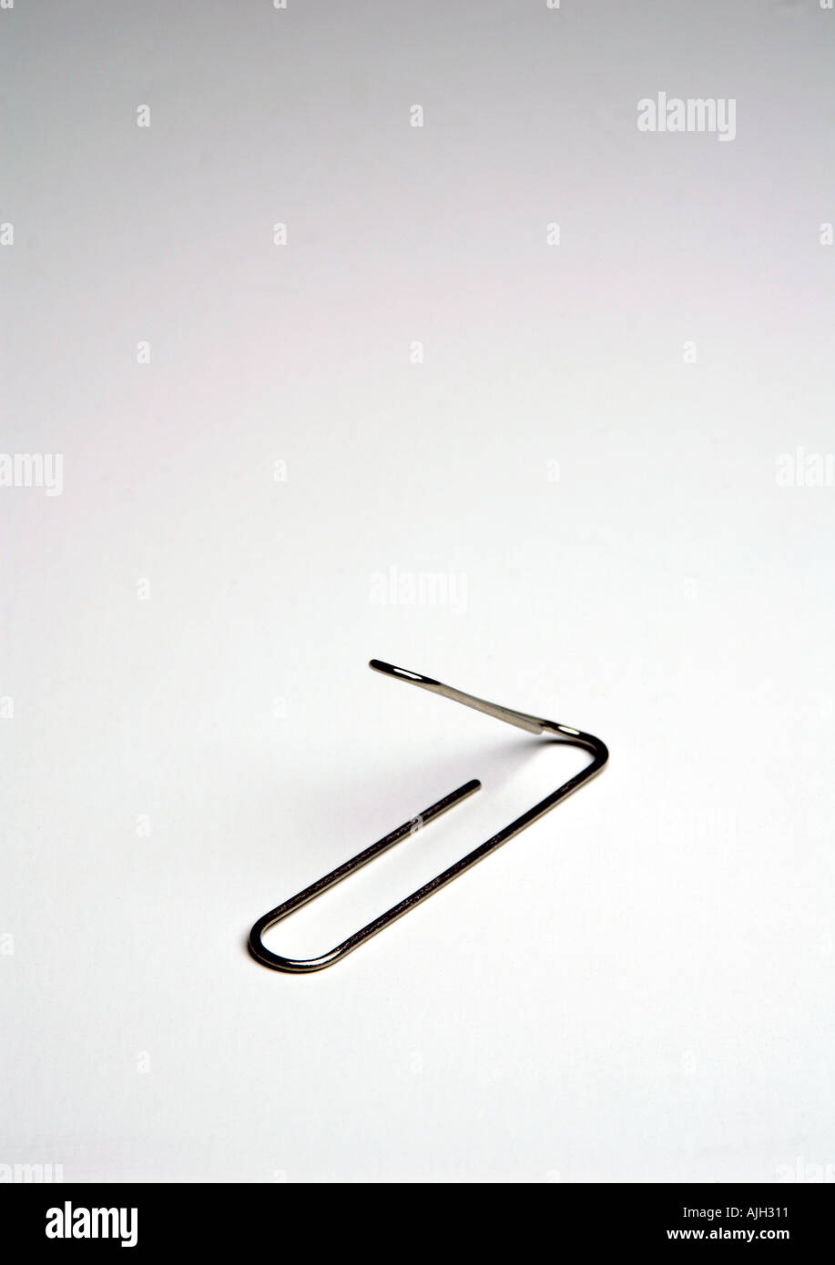 bent paper clip Stock Photo