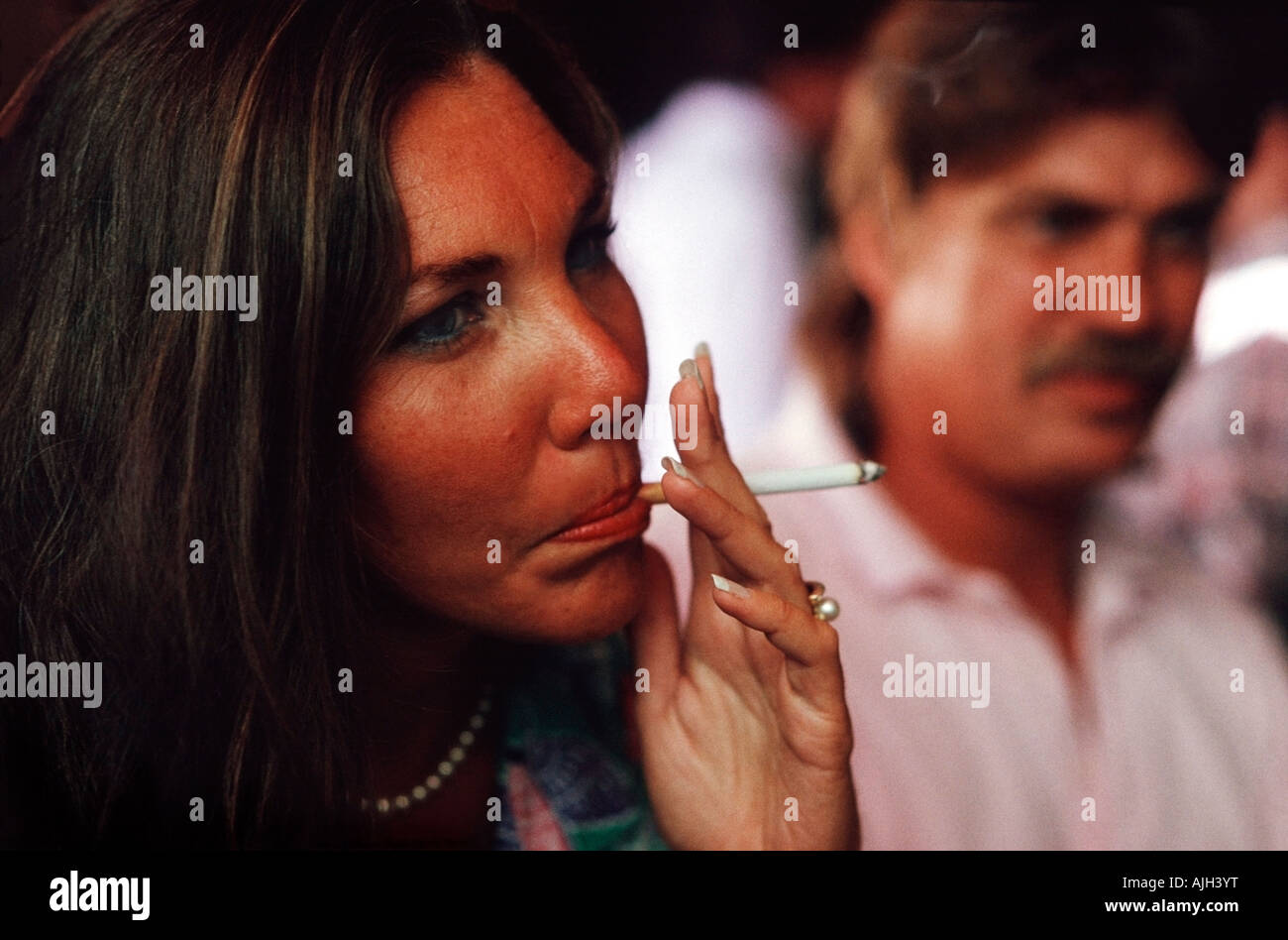 Cigarette smoking in public place hi-res stock photography and images