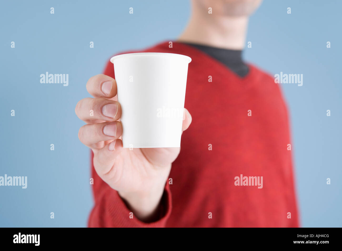 Man holding paper cup Stock Photo - Alamy