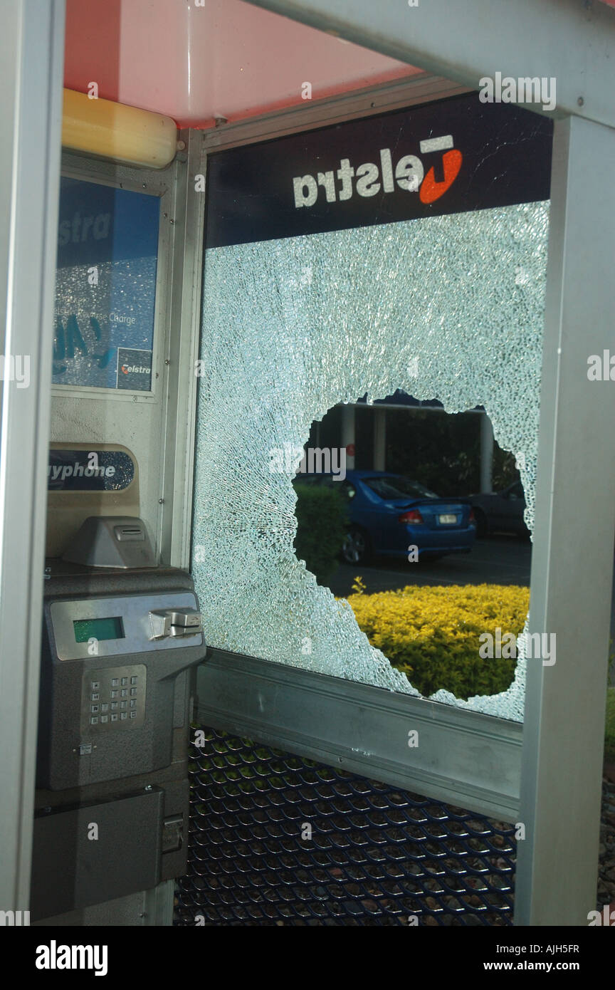 vandalized pay phone booth Stock Photo