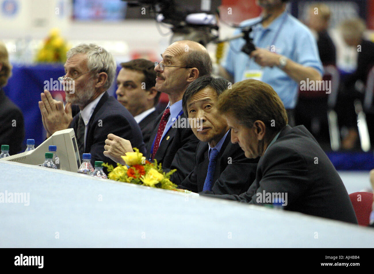 gymnastics judges deliberate on a score in a mens world  gymnastics competition Stock Photo
