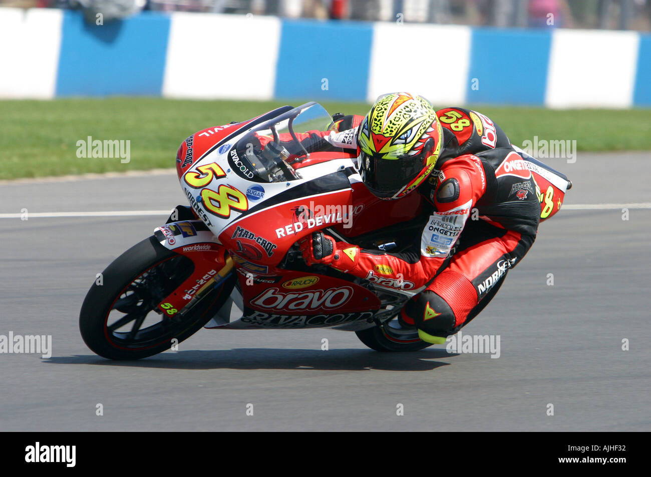 Marco Simoncelli on his 125cc gilera at speed exiting Goddards at donington Park, England , UK Stock Photo