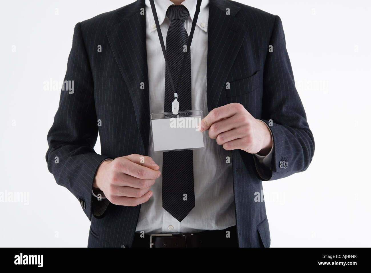 Businessman wearing ID card Stock Photo - Alamy