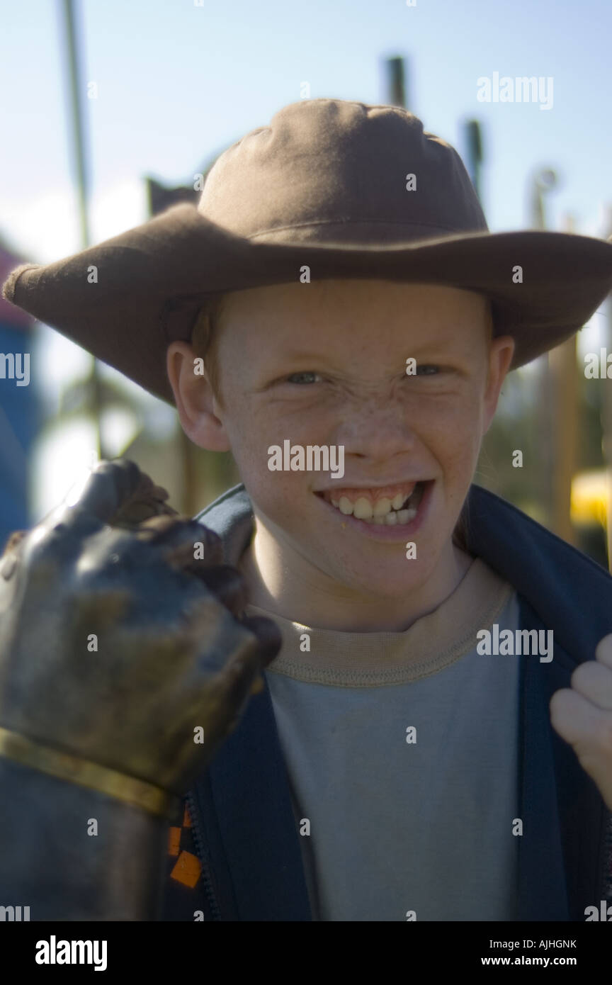 young boy iron gloves fist fight punch knock out Stock Photo