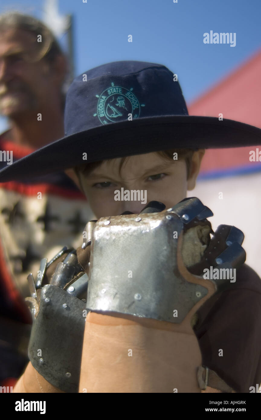 young boy iron gloves fist fight punch knock out Stock Photo