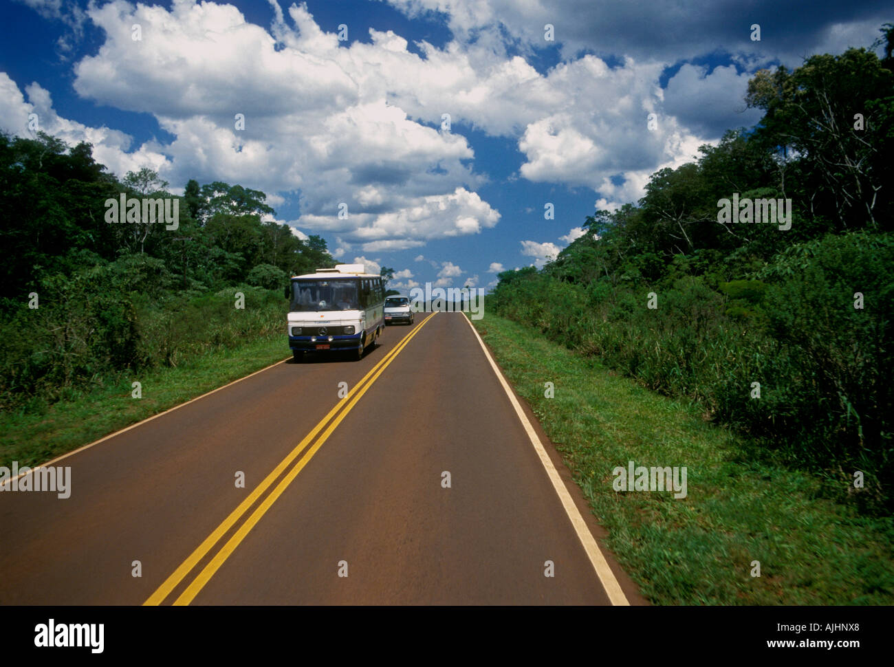 Tour bus on highway to Puerto Iguazu Misiones Province Argentina South America Stock Photo