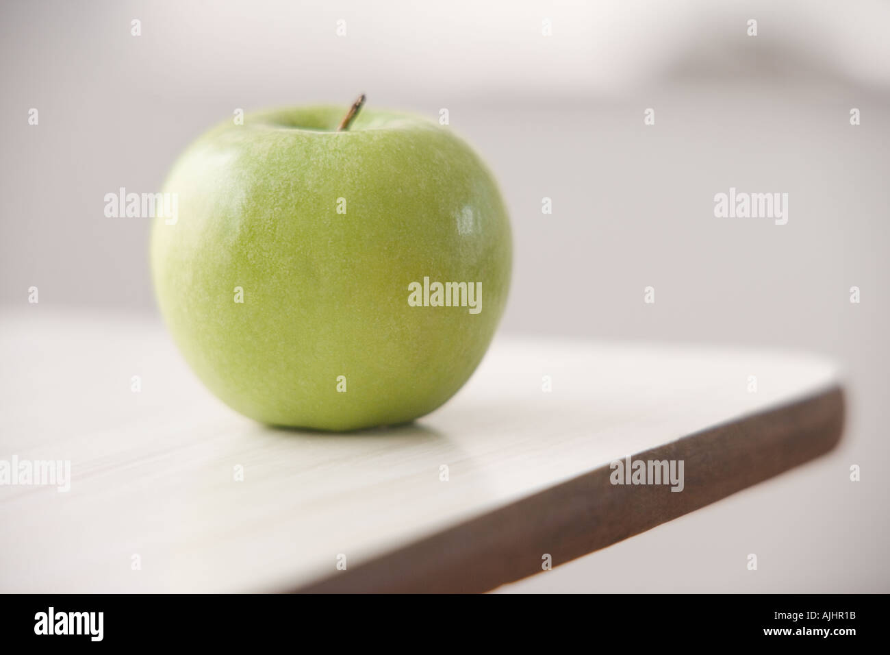 Apple on a desk Stock Photo Alamy