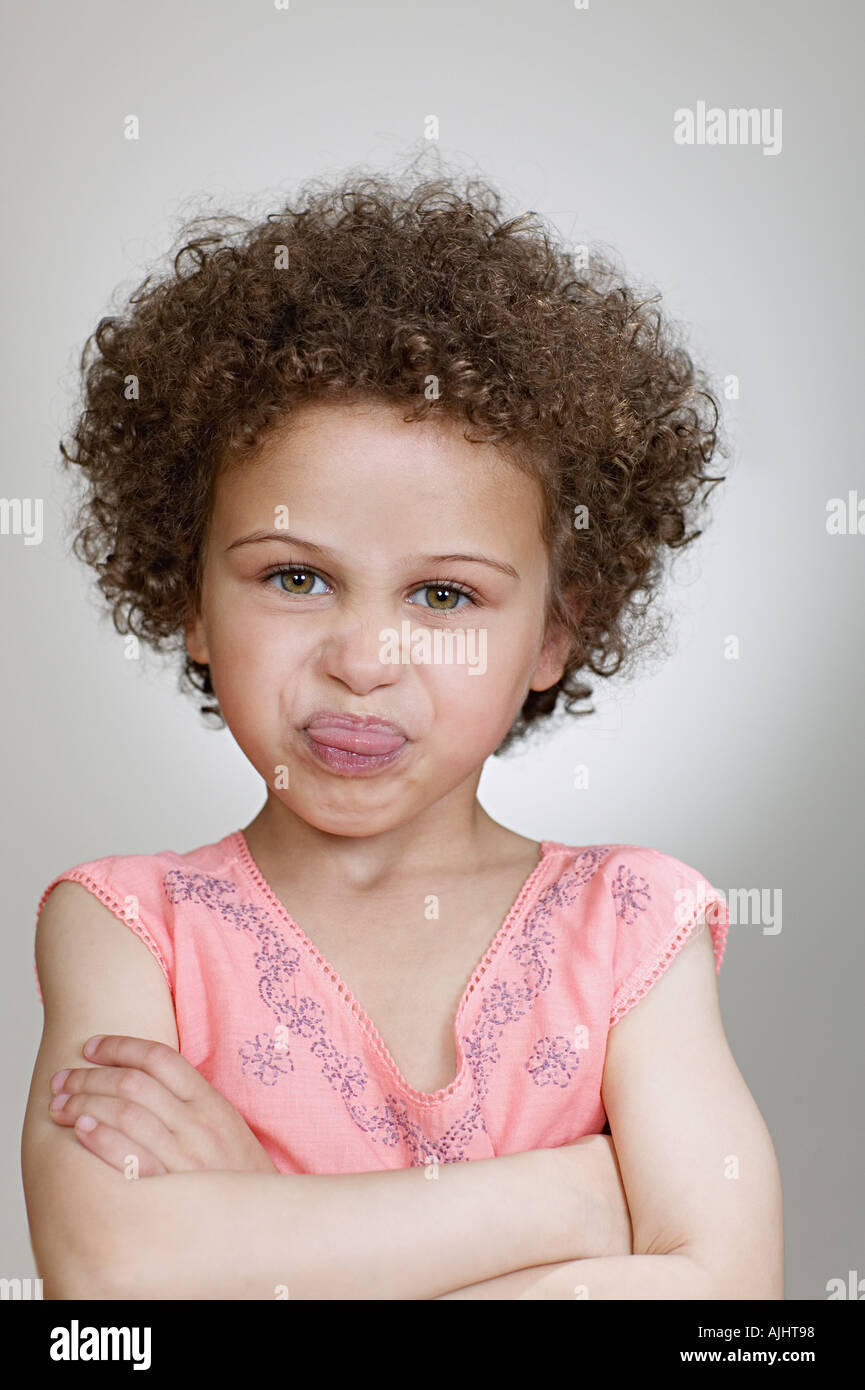 Girl sticking out tongue Stock Photo