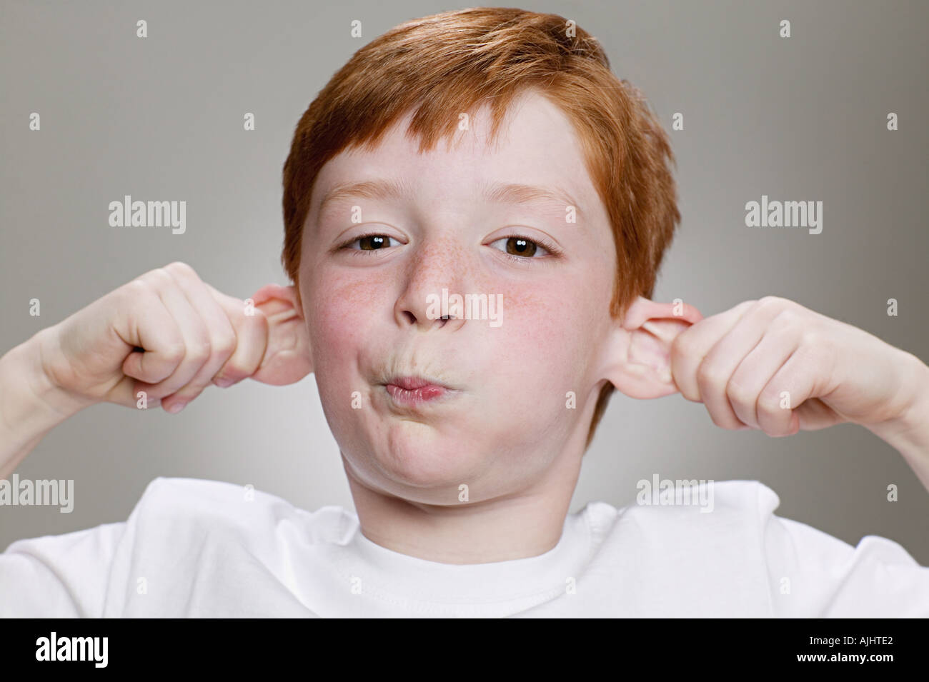 Boy pulling a funny face Stock Photo Alamy