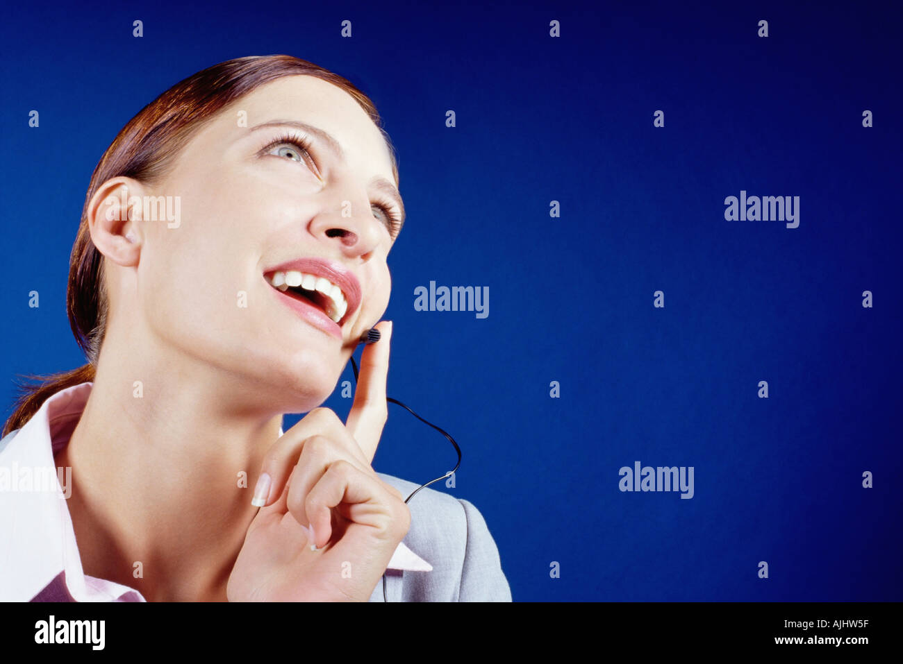 Businesswoman using telephone headset Stock Photo
