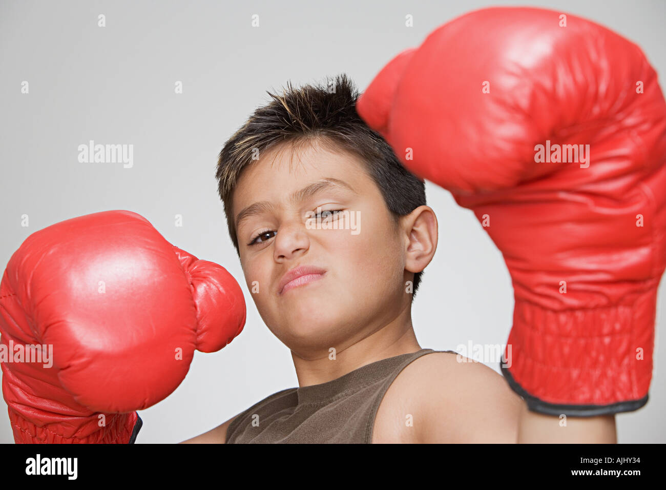 Boy wearing boxing gloves Stock Photo