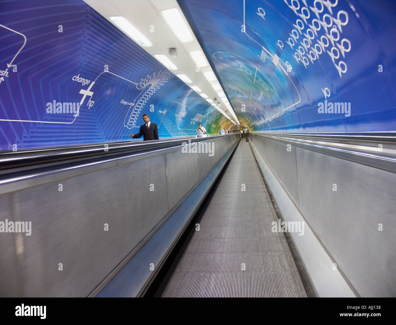 Escalator corridor in underground subway station London England UK  Stock Photo