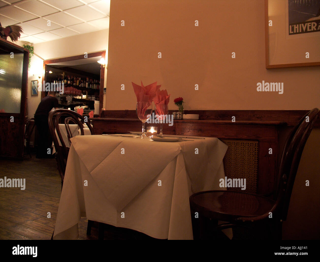 Empty table waiting for dinner guests at a French restaurant near Earl s Court tube station in Kensington London England UK Stock Photo