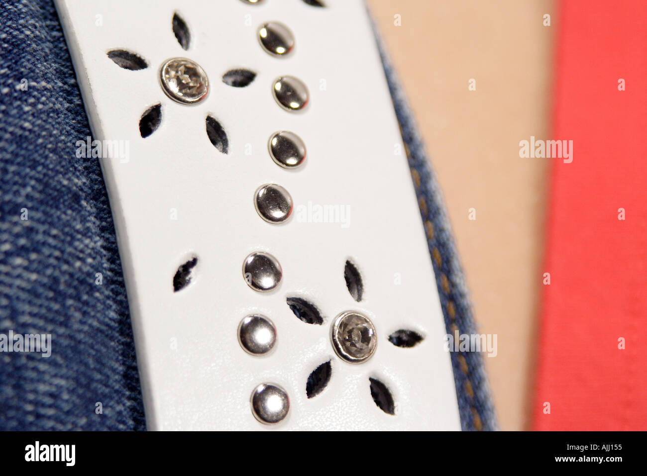 White belt punched holes and rivets Stock Photo Alamy