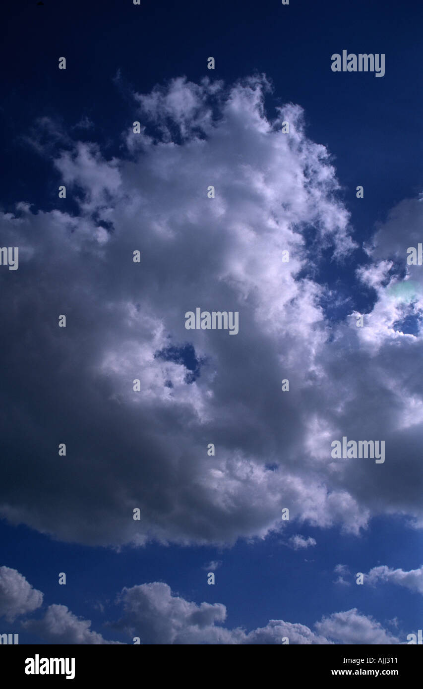 Fluffy cumulus clouds deep blue sky Stock Photo - Alamy